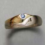 Other Rings 1-2: Stylized Royal Arches with a blue sapphire in white and yellow gold
