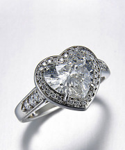 Other Rings 1-1: Heart shaped diamond surrounded by a bead set frame in platinum
