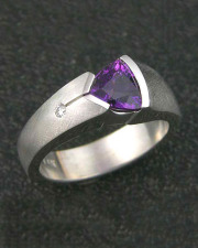 Other Rings 2-10: Triangular cut purple sapphire partial bezel set in white gold