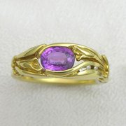 Other Rings 2-3: Oval purple sapphire partial bezel set with small diamonds and Calla Lily details in yellow gold