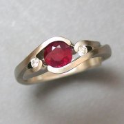 Other Rings 3-7: Round cut ruby partial bezel set with small diamonds in white gold