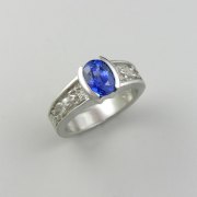 Other Rings 3-9: Oval blue sapphire partial bezel set with frogs down the sides in white gold