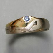 Other Rings 1-2: Stylized Royal Arches with a blue sapphire in white and yellow gold