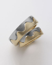 Bands 1-12: 18-karat yellow gold and platinum open wave matching wedding bands