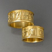 Bands 1-7: His and Hers bands with Mayan symbols in yellow gold