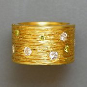 Bands 2-1: Wide textured band with round cut yellow and clear diamonds set in yellow gold