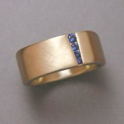 Bands 2-9: Small blue sapphires in a squared style yellow gold band