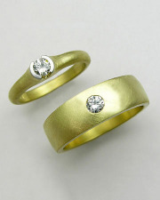 Bands 3-1: His and Hers engagement ring and wedding band with round cut diamonds in platinum and yellow gold