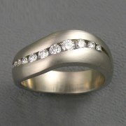 Bands 3-6: Curved band with channel set diamonds in platinum