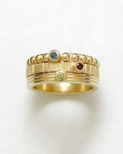 Bands 4-2: 14kt. yellow gold stacking rings with a sapphire, ruby and peridot