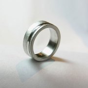 Bands 4-6: 14kt. white gold custom gents band with independently rotating high polished center band