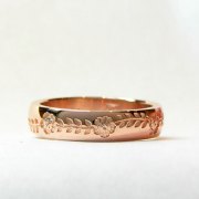 Bands 1-4: 14kt. rose gold custom band with flower and leaf motif