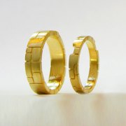 Bands 1-1: 18kt. yellow gold custom matching bands with stone motif (two bands key into each other)