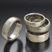 Damascus stainless steel grouping, slightly domed and flat band styles
