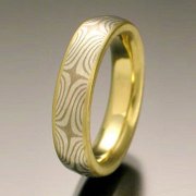 Mokeme Gane Star pattern in 14kt. White Gold and silver set in an 18kt. Yellow Gold lining with narrow rails, slightly domed band style