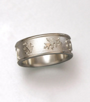 14kt. white gold band with Oak leaf and other symbols