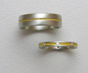 Pair of Platinum bands with 24k Inlay, small Diamonds