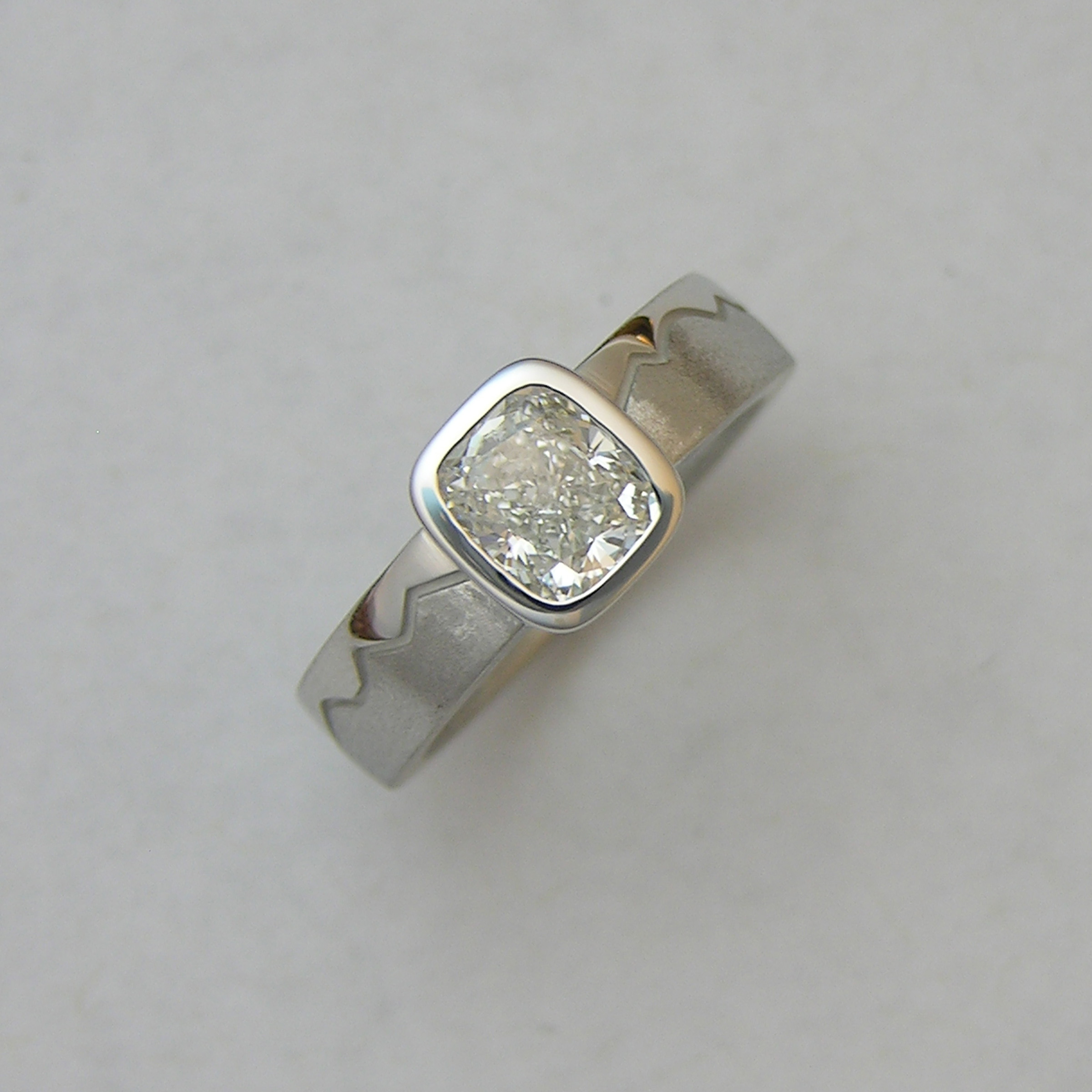 14karat White gold Indian Peaks Skyline Engagement ring with Cushion cut Diamond in full bezel