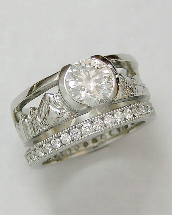 Mountain Engagement Rings 1-1: Platinum diamond Boulder Peaks ring with channel set miligrain eternity band