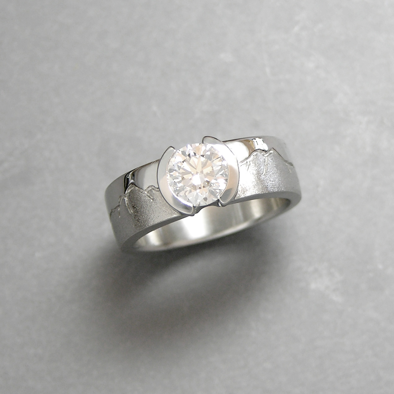 Platinum Aspen Skyline Engagement ring with .90carat Round Brilliant cut Diamond in partial bezel