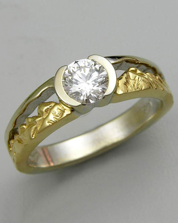 Mountain Engagement Rings 1-12: 14kt. yellow and white gold two-tone Twin Peaks engagement ring with a partially bezel set round diamond in the center