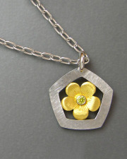 Necklace 1-5: Yellow gold flower with a yellow diamond surrounded by a white gold hammered frame