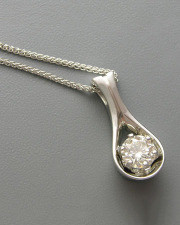 Necklace 2-2: Round cut diamond set in a teardrop style pendant in white gold