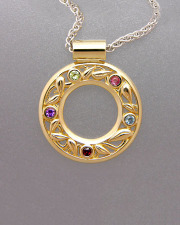 Necklace 2-3: Various colored stones full bezel set around a leaf pattern pendant in yellow gold