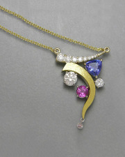 Necklace 2-8: Necklace with various shaped and colored stones in white and yellow gold