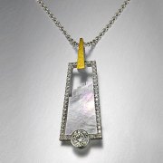 Necklace 3-1: Mother of pearl framed by bead set diamonds with a full bezel set diamond in platinum and yellow gold