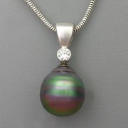 Necklace 3-3: Baroque black pearl and diamond pendant in 14karat white gold