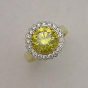 18karat Yellow gold ring with Platinum scalloped Halo holding Round Diamonds, 24karat frame surrounding center Yellow Diamond