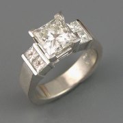 Engagement Ring 2-10: Princess cut diamond square prong set with Princess cut channel set diamonds on the sides