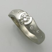 Engagement Ring 3-11: Round cut diamond partial bezel set in white gold