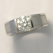 Engagement Ring 3-4: Round cut diamond channel set in white gold