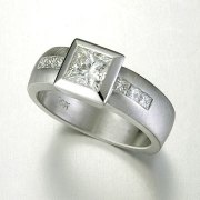 Engagement Ring 3-7: Princess cut diamond full bezel set in white gold with channel set princess cut diamonds on the sides