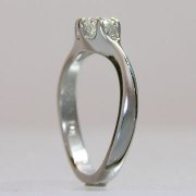 Engagement Ring 4-6: Round cut diamond prong set in white gold this a twist