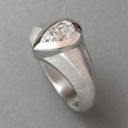 Engagement Ring 5-2: Pear cut diamond full bezel set in white gold