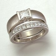 Engagement Ring 5-4: Princess cut diamond channel set in white gold shown with Princess cut diamond channel set band