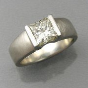 Engagement Ring 6-10: Princess cut diamond channel set in white gold