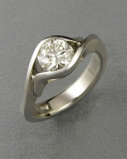 Engagement Ring 6-11: Round cut diamond partial bezel set in white gold
