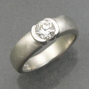 Engagement Ring 6-7: Round cut diamond partial bezel set in white gold