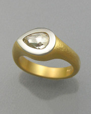 Engagement Ring 6-9: Pear cut diamond full bezel set in platinum and yellow gold