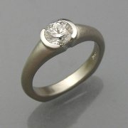 Engagement Ring 7-2: Round cut diamond partial bezel set in platinum