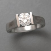 Engagement Ring 7-8: Round cut diamond channel set in white gold