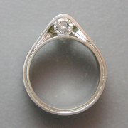 Engagement Ring 7-9: Round cut diamond partial bezel set on the side in platinum