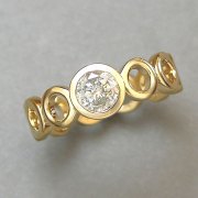Engagement Ring 8-2: 14kt. yellow gold engagement ring with bezel set center diamond and circle motif band
