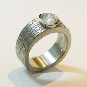 Engagement Ring 8-3: 14kt. white gold full bezel diamond engagement ring with heavy texture