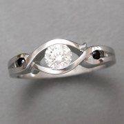 Engagement Ring 8-4: 14kt. white gold partial bezel diamond engagement ring with black diamonds on each side