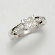 Engagement Ring 9-1: 14kt. white gold diamond engagement ring with center diamond set in split channel and bead set side diamonds